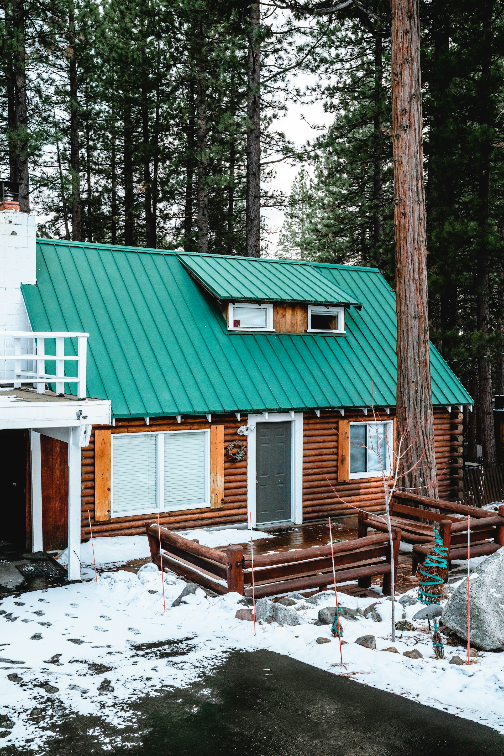 A photo of a wooden house in the forest